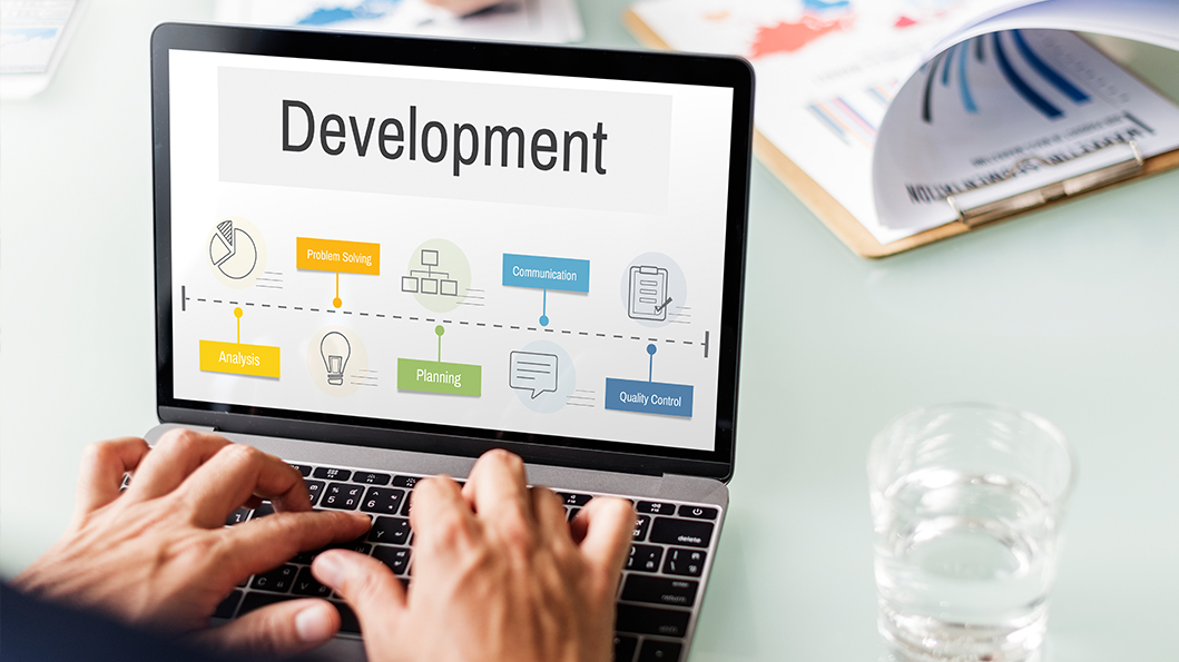 Custom web development services in Sri Lanka showcased through Sha Web Design's coding and design workflow illustration
